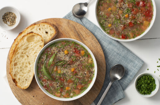 quinoa-soup-with-tomato-and-fresh-herbs-served-with-bread
